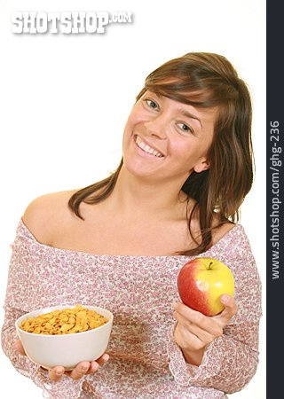 
                Junge Frau, Frau, Gesunde Ernährung, Apfel, Cornflakes                   
