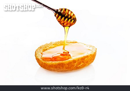 
                Honig, Honiglöffel, Honigbrötchen                   