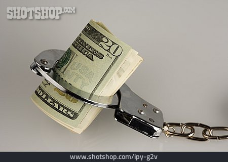 
                Steuerhinterziehung, Handschelle, Geldrolle, Geldstrafe                   