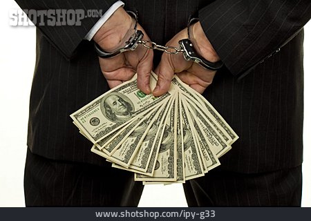 
                Wirtschaftskriminalität, Bargeld, Handschelle                   