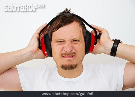 
                Mann, Laut, Lärm, Gehörschutz                   
