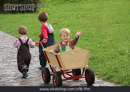 
                Waving, Siblings, Toy Wagon                   