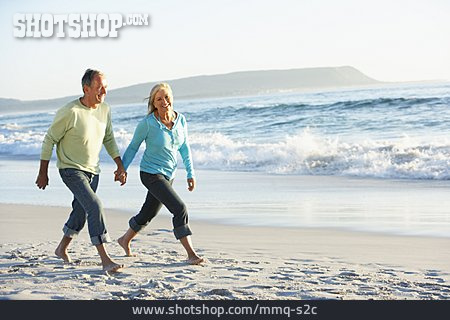 
                Relaxing, Beach Walking, Older Couple                   