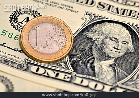 
                Euromünze, Dollarschein                   