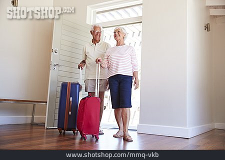 
                Arriving, Rolling Suitcase, Holiday Apartment, Older Couple                   