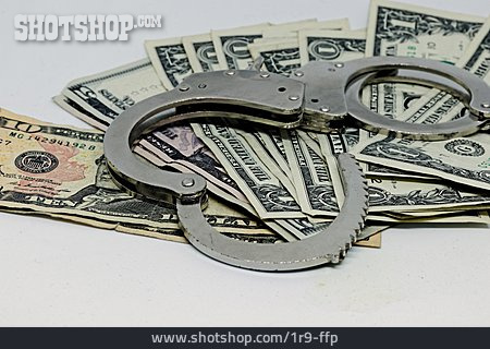 
                Kriminalität, Handschelle, Dollarschein                   