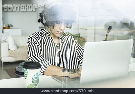 
                Young Man, Leisure, Typing, Laptop, Listening Music                   
