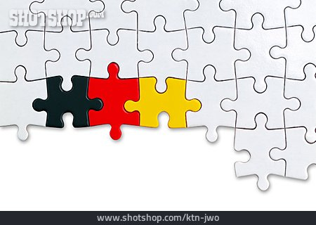 
                Puzzle, Schwarz-rot-gold                   
